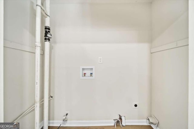 clothes washing area featuring hookup for a washing machine and hookup for an electric dryer