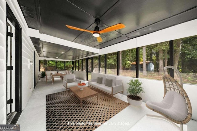 sunroom / solarium with ceiling fan