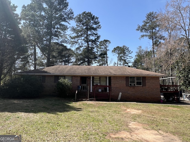 ranch-style house with brick siding and a front lawn