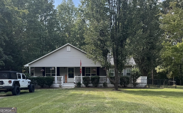 view of front of house featuring a front yard and covered porch