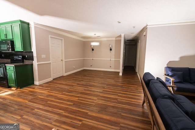 living room featuring ornamental molding and dark hardwood / wood-style floors