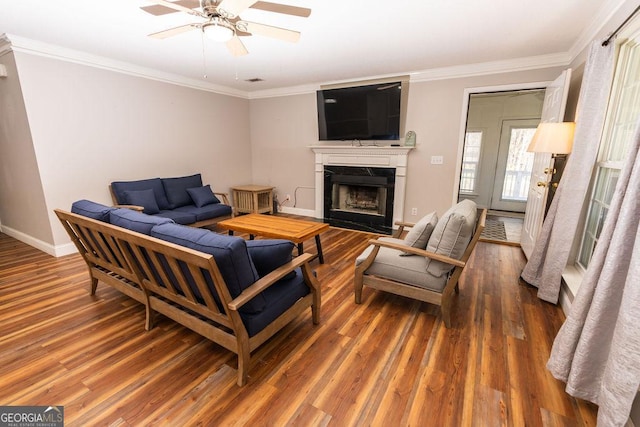 living room featuring ornamental molding, dark hardwood / wood-style floors, and ceiling fan