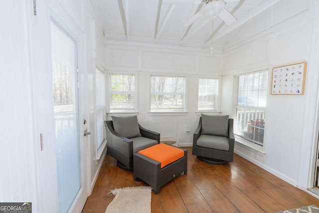 living area featuring hardwood / wood-style floors, a wealth of natural light, and ceiling fan