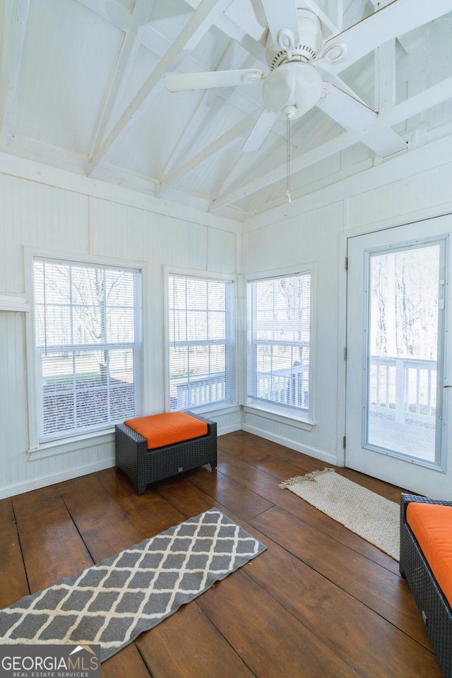 sunroom / solarium with a wealth of natural light, lofted ceiling with beams, and ceiling fan