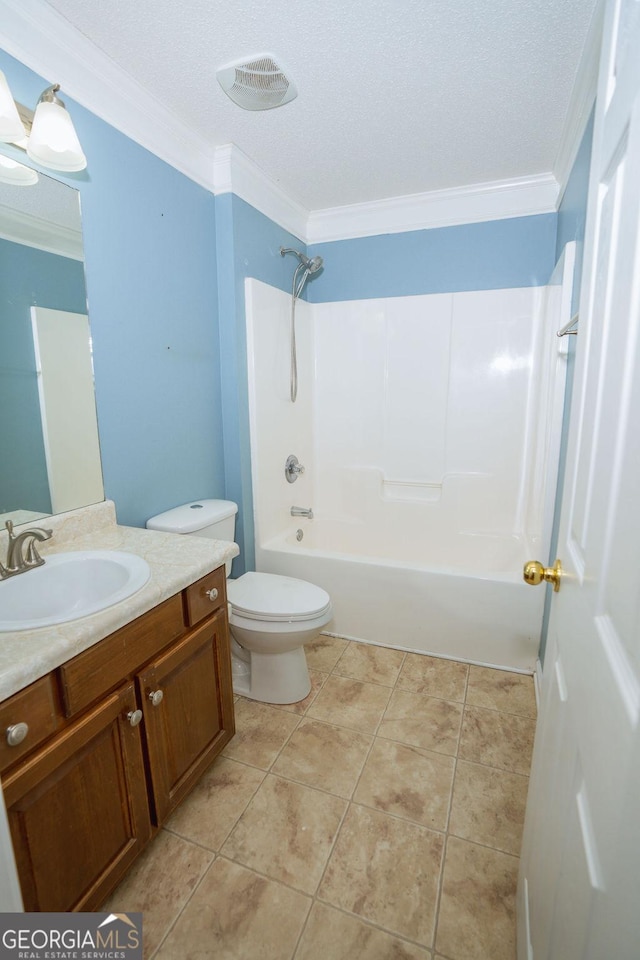 full bathroom with shower / washtub combination, vanity, ornamental molding, tile patterned floors, and toilet