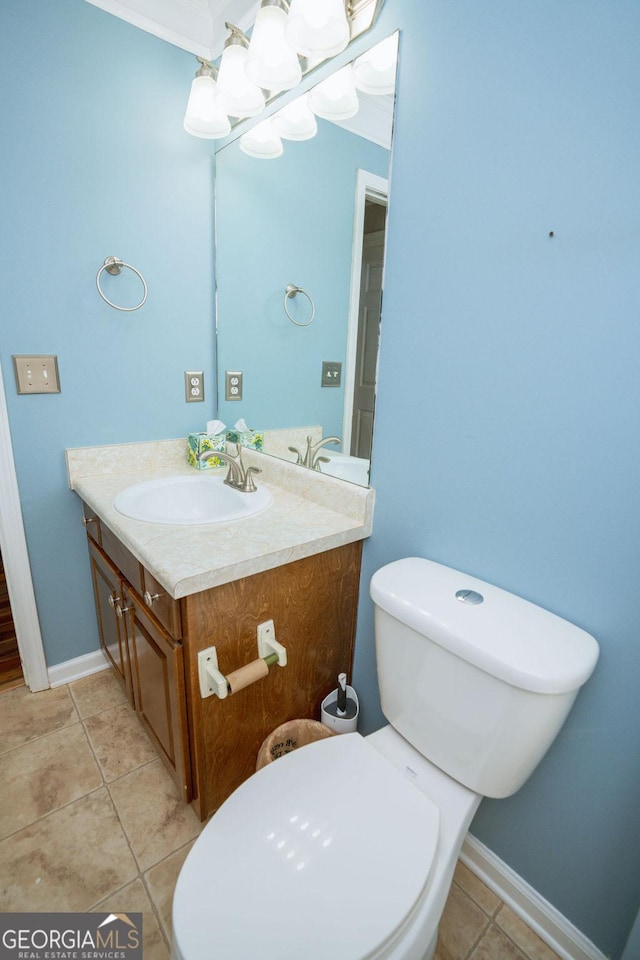 bathroom with tile patterned floors, vanity, and toilet