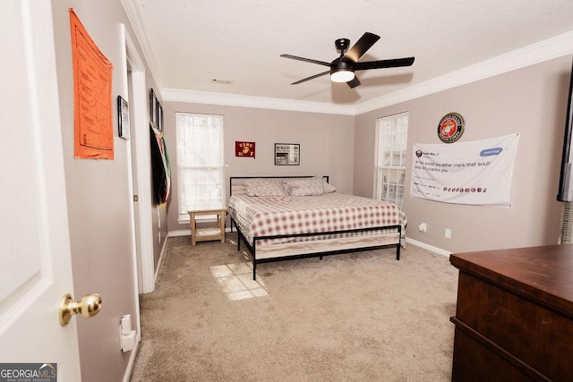 bedroom with ceiling fan, ornamental molding, carpet, and multiple windows