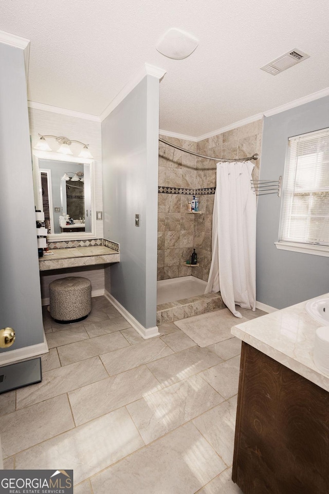 bathroom with vanity, crown molding, and a shower with curtain