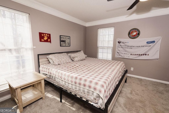 bedroom with crown molding, carpet floors, and ceiling fan