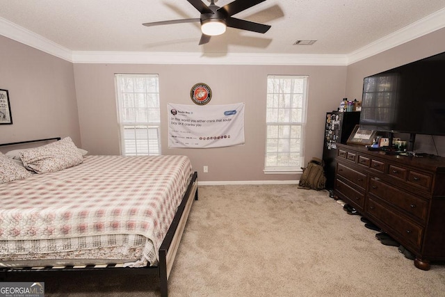 carpeted bedroom with crown molding and ceiling fan