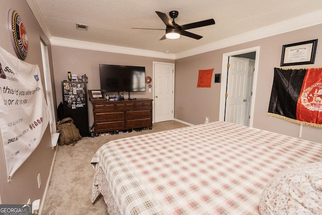 bedroom with light carpet, ceiling fan, crown molding, and a textured ceiling