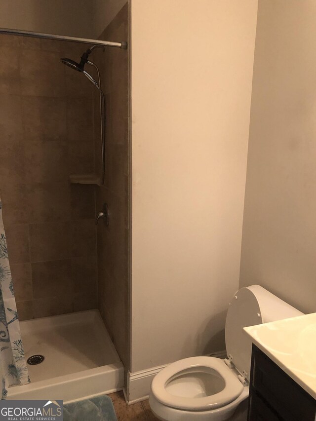 284 Madison Grace Ave, Mcdonough, GA 30252 - bathroom with toilet, a stall shower, and vanity