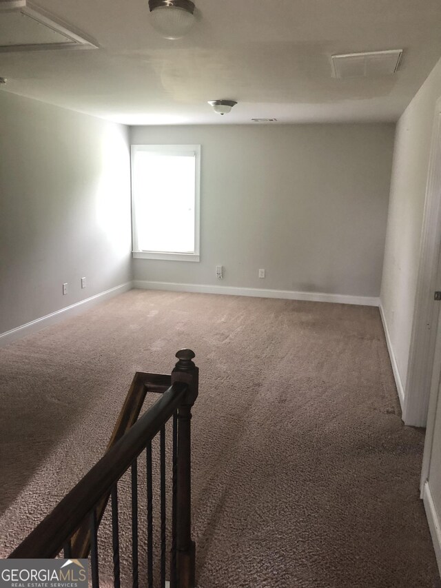 284 Madison Grace Ave, Mcdonough, GA 30252 - carpeted spare room featuring baseboards