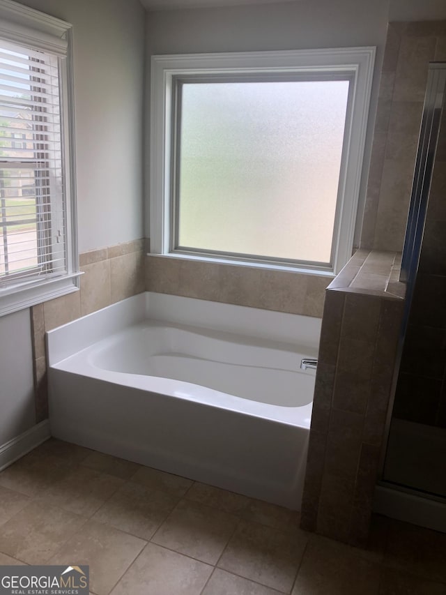 284 Madison Grace Ave, Mcdonough, GA 30252 - full bathroom featuring plenty of natural light, a bath, and tile patterned floors