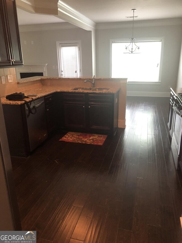 284 Madison Grace Ave, Mcdonough, GA 30252 - kitchen featuring a sink, dishwasher, a fireplace, light stone countertops, and plenty of natural light