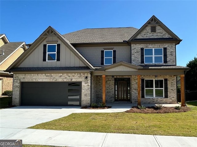 craftsman house with a garage and a front lawn