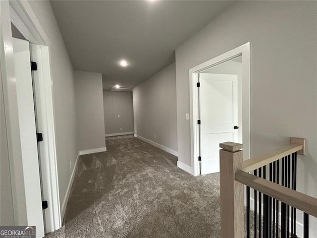 hallway with dark carpet