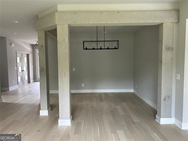 unfurnished dining area featuring light hardwood / wood-style floors
