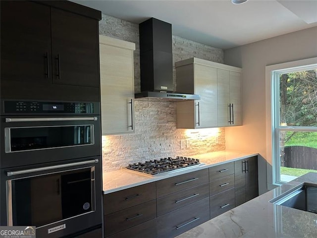 1534 Stargrass, Grayson, GA 30017 - kitchen featuring wall chimney exhaust hood, stainless steel gas cooktop, and modern cabinets