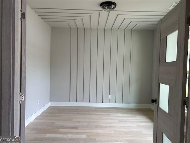 spare room featuring light wood-type flooring
