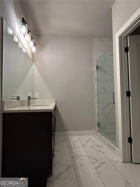 bathroom featuring vanity and walk in shower