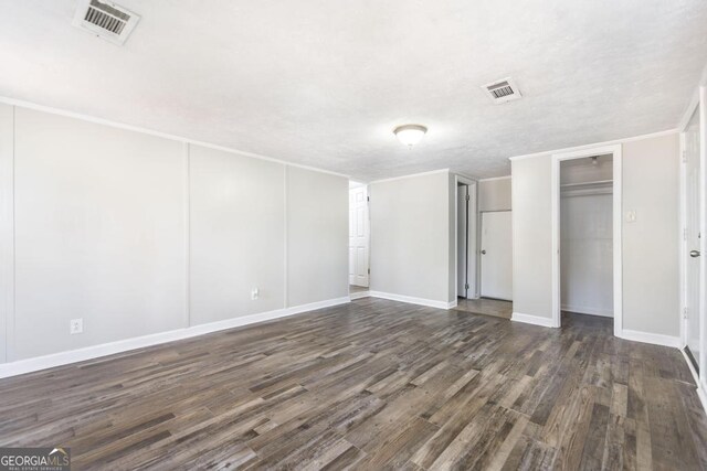 empty room featuring dark wood-type flooring