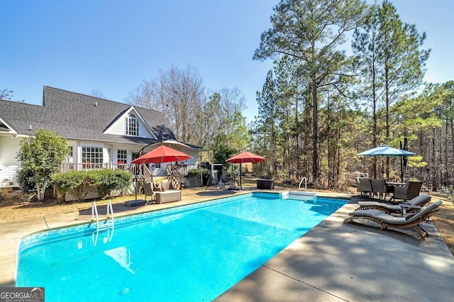 view of pool featuring a patio