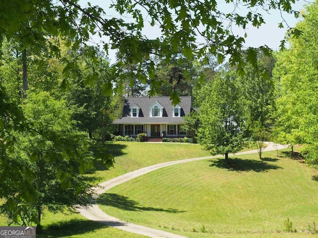 view of front facade with a front yard and a porch