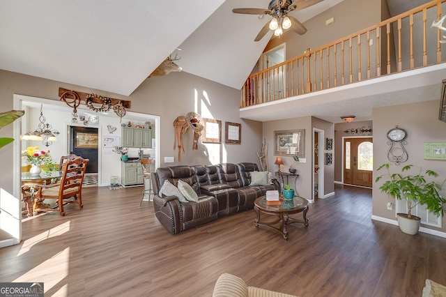 living room with ceiling fan, wood-type flooring, and high vaulted ceiling