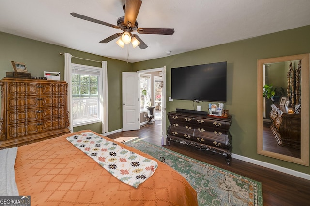 bedroom featuring ceiling fan and dark hardwood / wood-style flooring