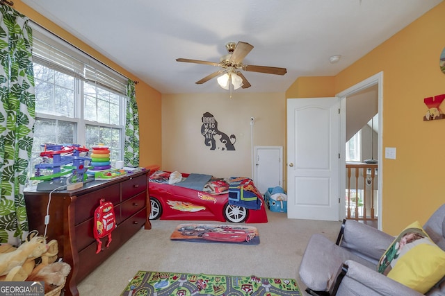 carpeted bedroom with ceiling fan