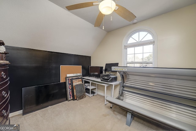 carpeted office featuring vaulted ceiling