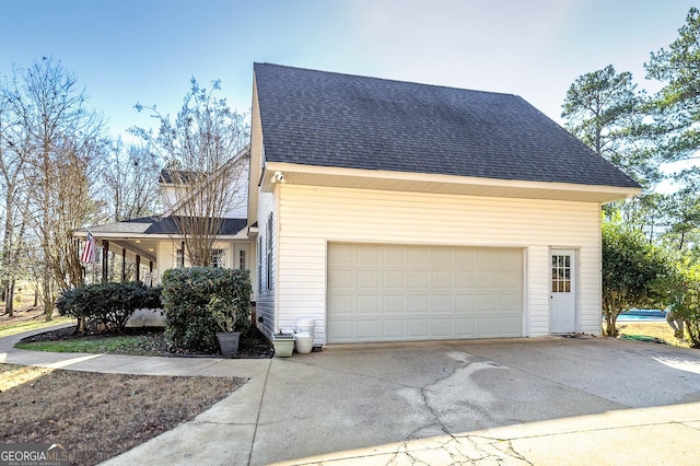 view of side of property with a garage