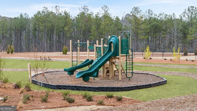321 Sound Cir, Stockbridge, GA 30281 - view of jungle gym featuring a lawn