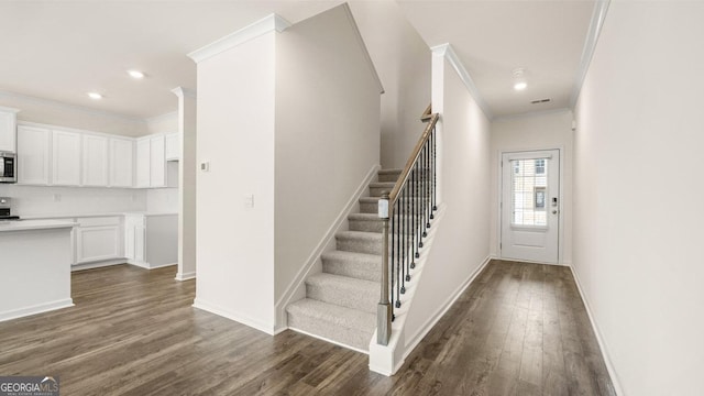 321 Sound Cir, Stockbridge, GA 30281 - foyer with crown molding and wood-type flooring