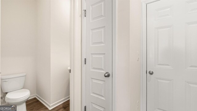 321 Sound Cir, Stockbridge, GA 30281 - bathroom featuring hardwood / wood-style floors and toilet