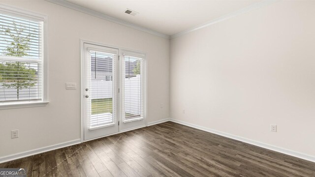 321 Sound Cir, Stockbridge, GA 30281 - doorway to outside featuring a healthy amount of sunlight, dark wood-type flooring, and ornamental molding