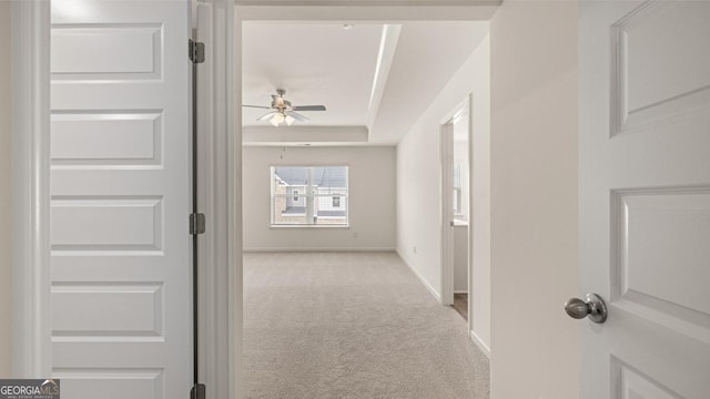 321 Sound Cir, Stockbridge, GA 30281 - hallway featuring a raised ceiling and light colored carpet