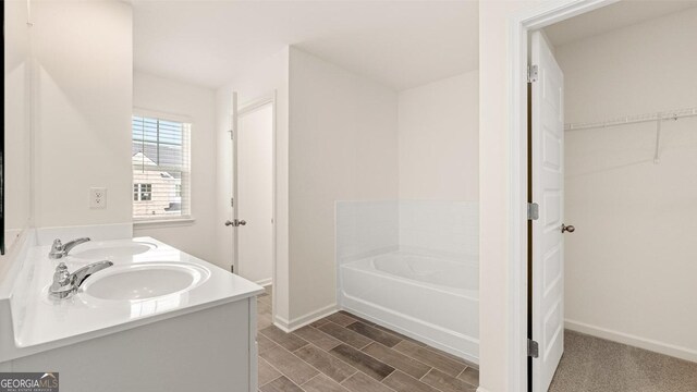 321 Sound Cir, Stockbridge, GA 30281 - bathroom with sink and a tub to relax in