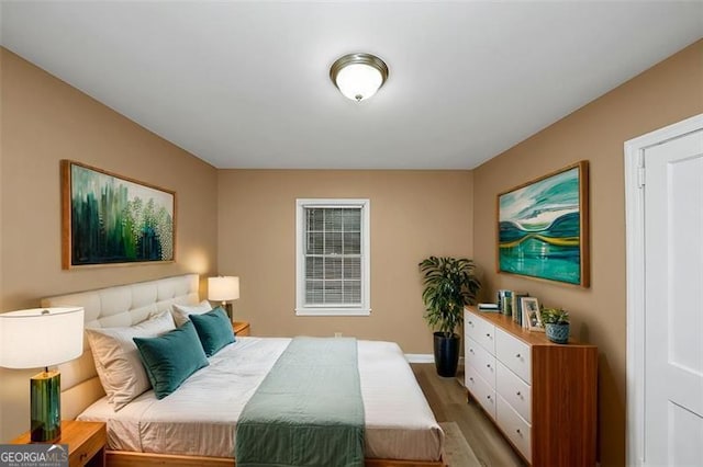 bedroom featuring hardwood / wood-style flooring