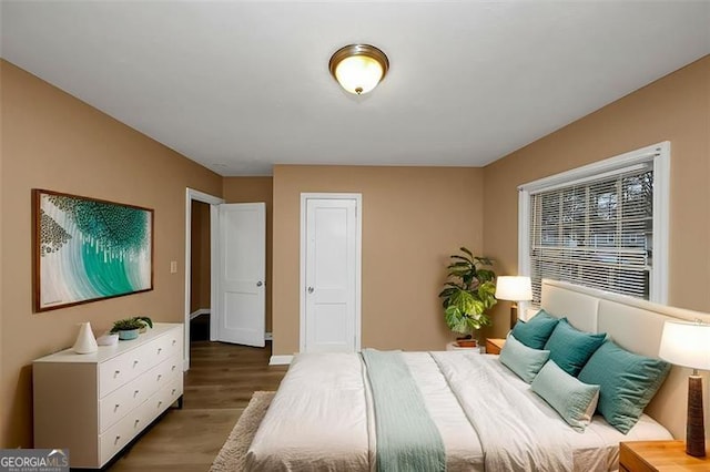 bedroom with hardwood / wood-style floors