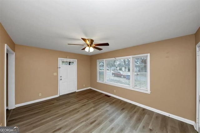 unfurnished room featuring ceiling fan and hardwood / wood-style floors