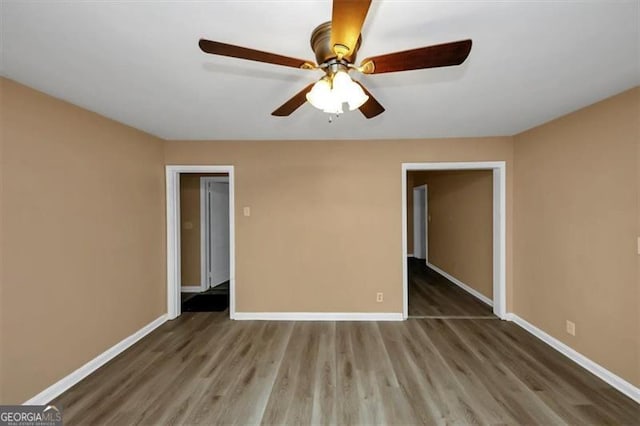 unfurnished bedroom with hardwood / wood-style flooring and ceiling fan