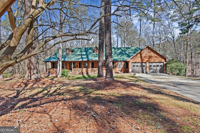 view of front of house with a garage and covered porch