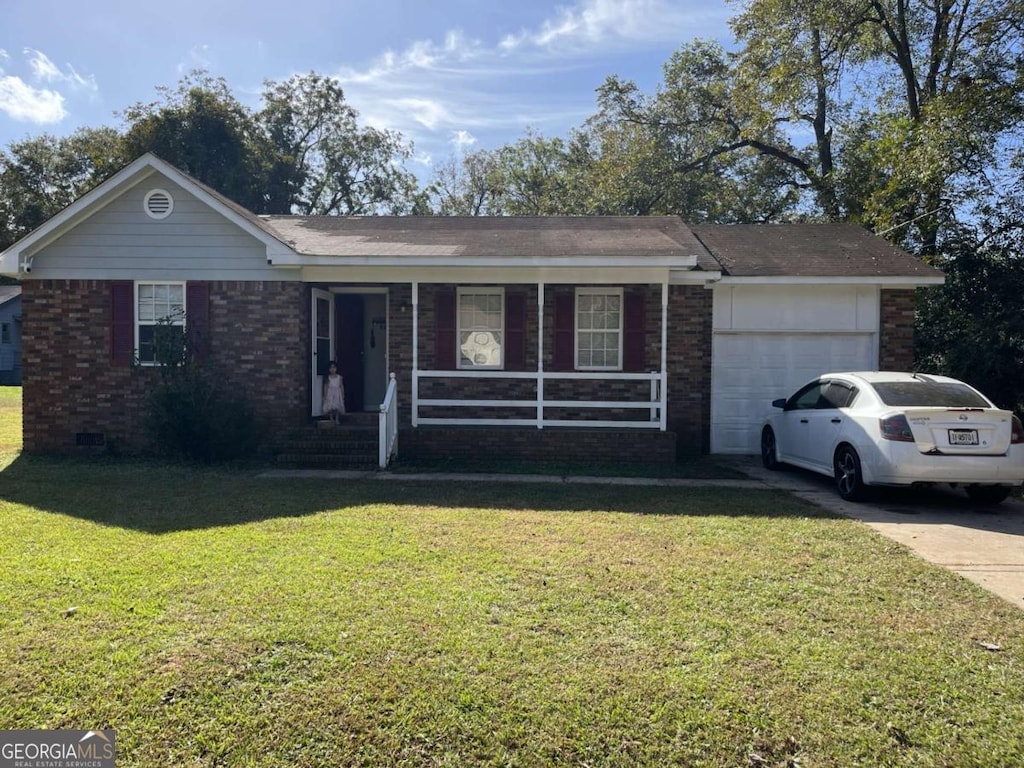 single story home with a garage and a front lawn