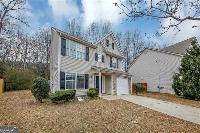 view of front of house with a garage and a front lawn