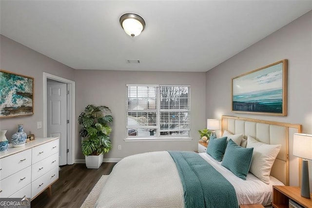 bedroom featuring dark hardwood / wood-style floors