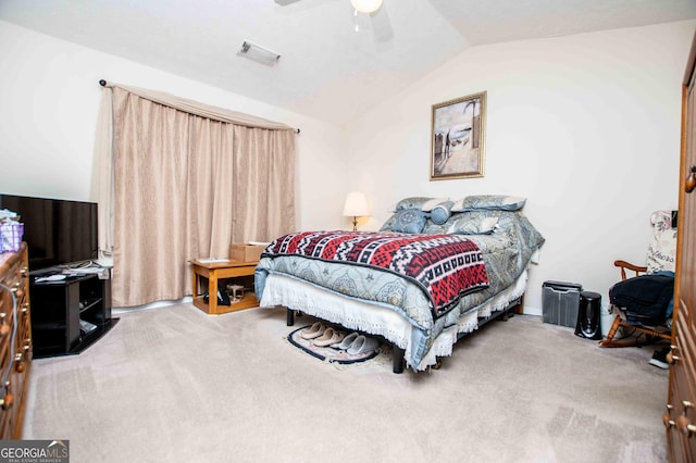 carpeted bedroom featuring vaulted ceiling and ceiling fan