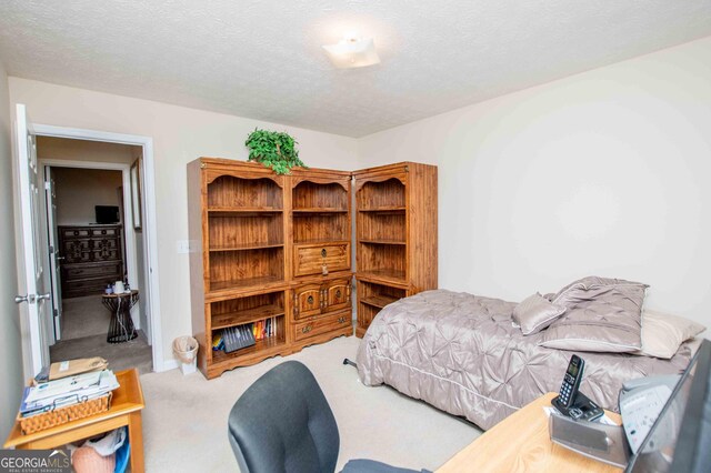 bedroom featuring light carpet and a closet