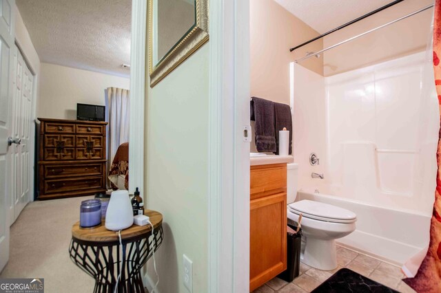 full bathroom featuring tile patterned flooring, vanity, shower / bathtub combination with curtain, and toilet